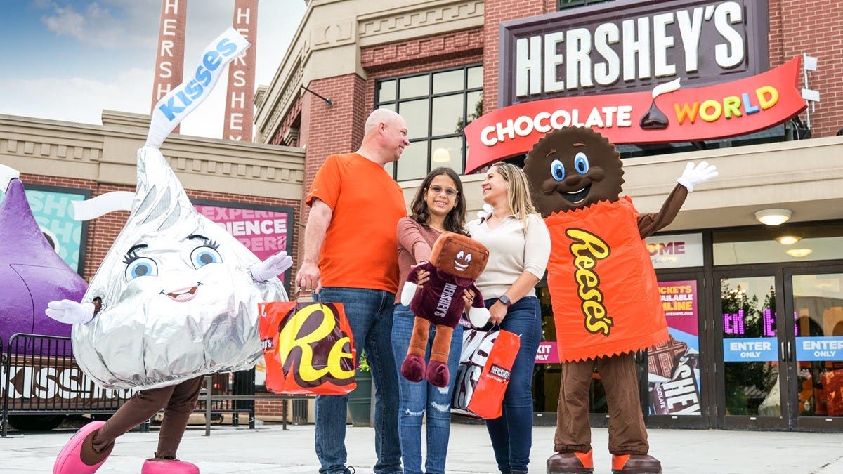 Family in front of HERSHEY'S CHOCOLATE WORLD